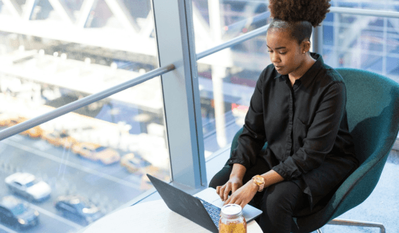 A corporate lady with a laptop.